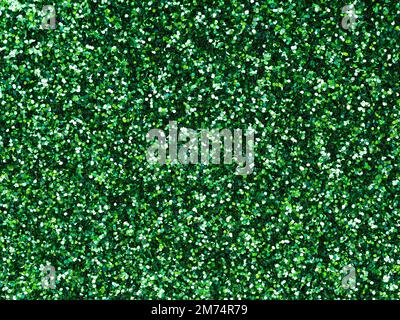 Dark green glitter. Perfect holographic background or pattern of sparkling shiny glitter for decoration and design of Christmas, New Year, Patrick Day Stock Photo