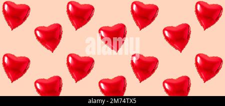 Many heart-shaped balloons on beige background. Patter for Valentine's Day Stock Photo