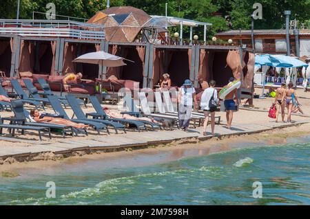 Odessa, Ukraine. July 23, 2021. Summer vacation season on the Black Sea in Odessa. Beach with sunbeds. Stock Photo