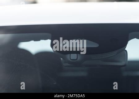 Windshield rain and light sensors of modern car. Car rain sensor. Stock Photo