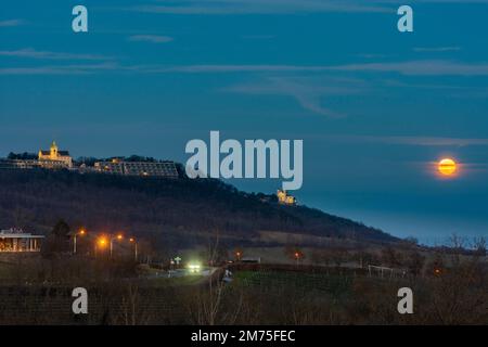 Wien, Vienna: full moon in Wienerwald (Vienna Woods) with restaurant Cobenzl, mountain Kahlenberg with antenna, mountain Leopoldsberg with church FLTR Stock Photo