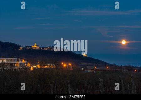 Wien, Vienna: full moon in Wienerwald (Vienna Woods) with restaurant Cobenzl, mountain Kahlenberg with antenna, mountain Leopoldsberg with church FLTR Stock Photo