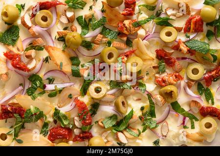 Homemade trendy butter board with sun-dried tomatoes , herbs and garlic. Pattern of butterboard. Stock Photo