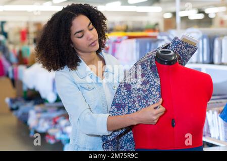 woman working on tailors dummy Stock Photo