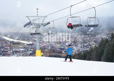 Seefeld, Austria - December 2022: Skiers at the top of the Gschwandtkopf ski slope in Seefeld. Warm weather has caused a snow shortage for many resort Stock Photo