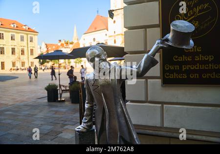 Slovakia, Bratislava - October 8, 2022: Schone Naci statue and old town Main Square in Bratislava Stock Photo