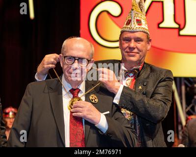 07 January 2023, Rhineland-Palatinate, Trier: Former football manager Reiner Calmund (l) receives the Emperor Augustus Order from Andreas Peters, President of the Trier Carnival Working Group (ATK). The order, which is endowed with 5555.55 euros and originally commemorates the founding of Trier - the oldest city in Germany - by the Roman Emperor Augustus, is awarded to well-known personalities who put themselves in the service of a good cause. At a carnival gala on Saturday evening, the former soccer manager received the Emperor Augustus Order from the Trier Carnival Working Group (ATK) - for Stock Photo