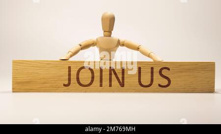 Join us was written on the wooden surface. Wooden Concept. Stock Photo