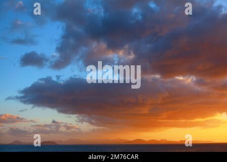Sunset light over Canary Islands . Awesome clouds over the Atlantic Ocean and island Stock Photo