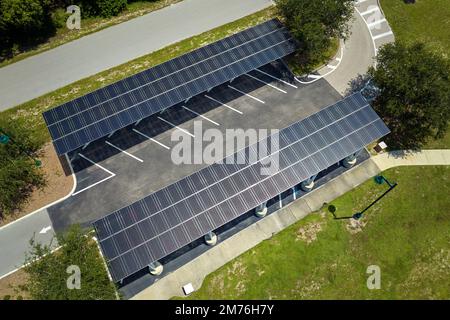 Solar panels installed over parking lot for parked cars for effective generation of clean energy Stock Photo