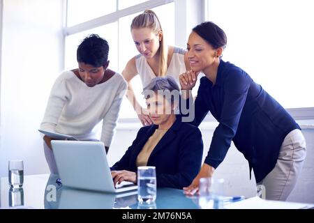 Putting their heads together. a group of coworkers having a meeting in the boardroom. Stock Photo