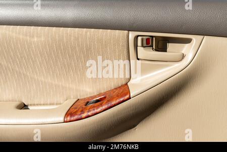 Door handle with lock and unlock with auto power window button Stock Photo