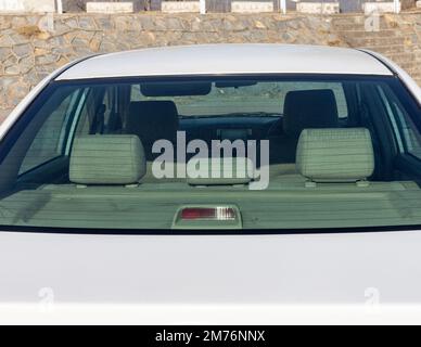 Rear seats headrest view inside the car back windshield Stock Photo