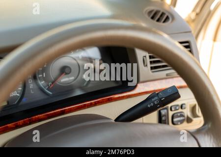 Adjustment lever of headlights in a car with selective focus Stock Photo