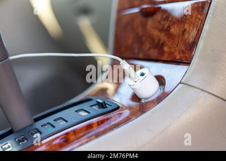 Phone Charger plug in a vehicle Stock Photo