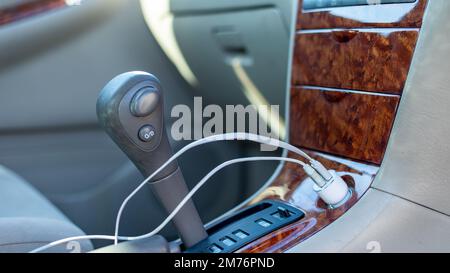A 12 volt usb universal charger for phones and tablets in a cigarette lighter port Stock Photo