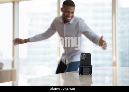 African man vlogger records his dance on cellphone camera Stock Photo