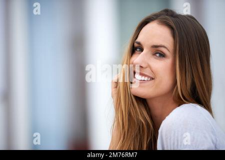 One small positive thought in the morning can change your whole day. Portrait of a beautiful woman sitting outside. Stock Photo