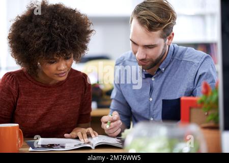 Meeting of the creative minds. two young design professionals working together in an office environment. Stock Photo