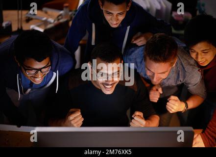 Smiling businessman with cheering team behind him Stock Photo - Alamy