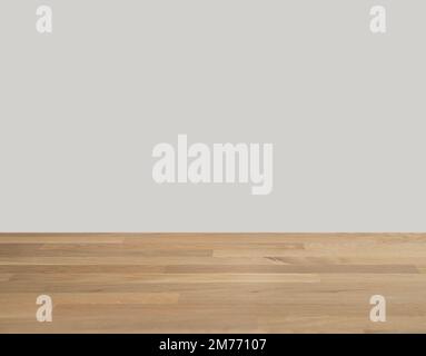 Wooden oak table top with free space for installing the product or layout on the beige background. Copy space. Stock Photo