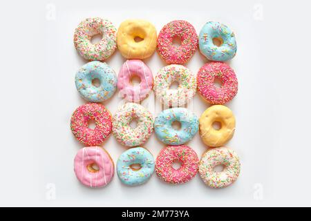 Colorful delicious donuts isolated on white background Stock Photo