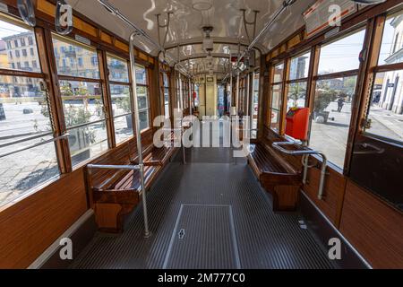 MILAN, ITALY, APRIL 4, 2022 - Inner view of a typical Milan tram with wooden furnishings in Milan, Italy. Stock Photo