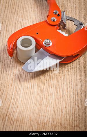 close up view on pipe cutter with cutted plasticqal pipe Stock Photo