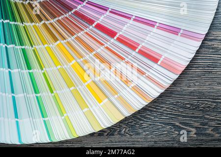 Color pantone fan on wooden board top view. Stock Photo