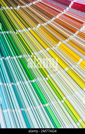Color pantone palette fan on wooden board top view. Stock Photo