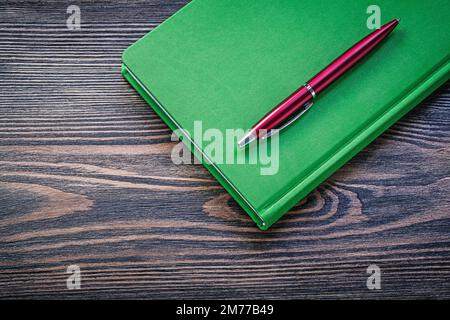 Notepad ball-point pen on wooden board education concept. Stock Photo