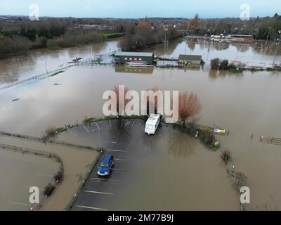 Hereford, Herefordshire, UK – Sunday 8th January 2023 – UK Weather – Aerial view of flooding along the River Wye as it passes through Hereford has resulted in riverside car parks and sports pitches being flooded. At 10am the River Wye was at 4.52m and rising as it flows through Hereford. More rain is forecast. Photo Steven May / Alamy Live News Stock Photo