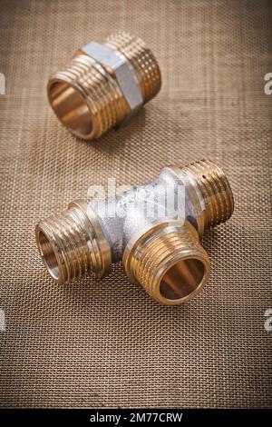 Plumbing fixtures connector fittings on water mesh filter. Stock Photo