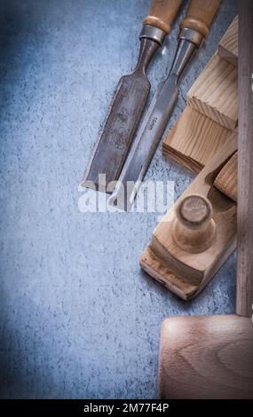 Set of carpenter’s tools on metallic background construction concept. Stock Photo