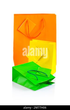 three colored paper bags isolated Stock Photo