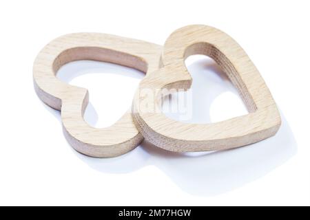 two wooden symbol toys hearts isolated on white Stock Photo