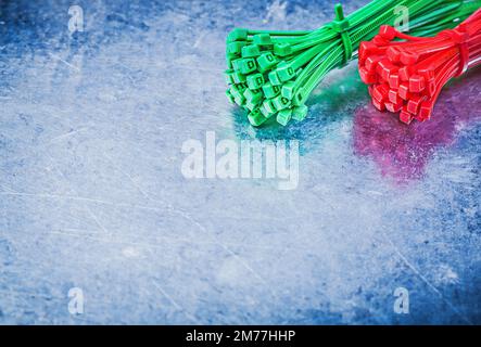 Variation of self-locking cable ties on metallic background construction concept. Stock Photo