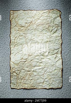 Vintage crumpled paper sheet on grey background. Stock Photo