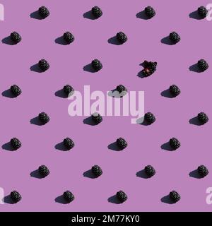 seamless pattern of blackberries on purple background  Stock Photo