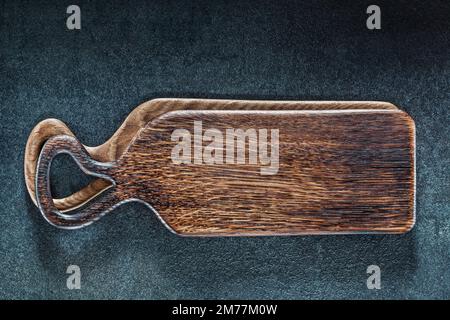 wooden vintage serving cutting boards on black background Stock Photo
