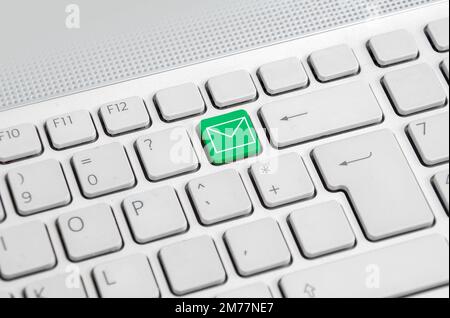 Closeup of a highlighted key business email on a computer keyboard. Stock Photo