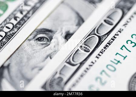 Benjamin Franklin's eyes from a hundred-dollar bill. 100 dollar bill Stock Photo