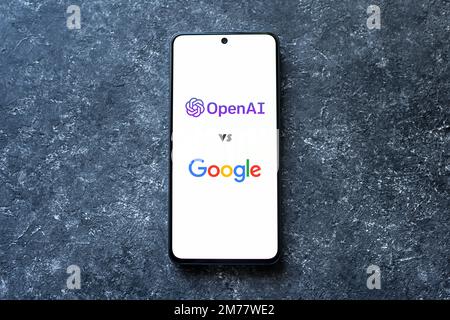OpenAI ChatGPT bot vs Google on phone screen on concrete background, AI replacing Google concept. Swansea, UK - January 3, 2023. Stock Photo