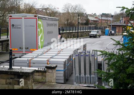 Flood defences ready to be deployed at Frankwell car park in Shrewsbury, which has been closed due to it's proximity to the river Severn. The Environment Agency (EA) has two flood warnings in place in the town. Picture date: Sunday January 8, 2023. Stock Photo