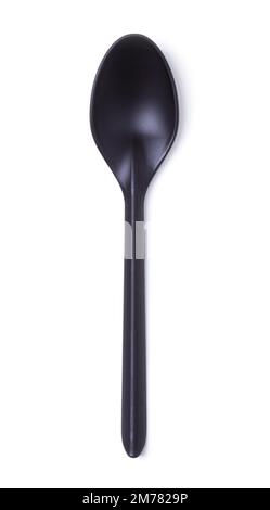 Black plastic spoon close-up isolated on white. View from above Stock Photo