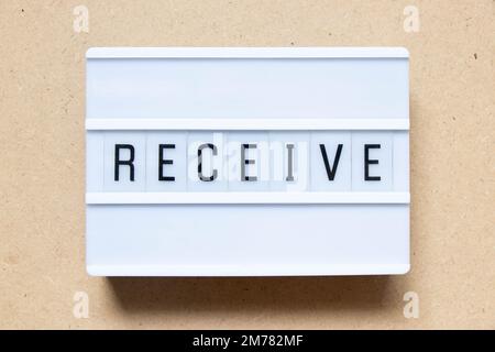 Lightbox with word receive on wood background Stock Photo
