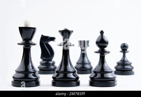 Chess pieces on a white background. Board logical antagonistic game. Intellectual sports. Stock Photo