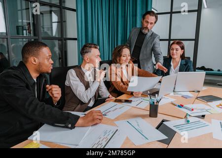 Business people in office connected on internet network analyzing statistics Stock Photo