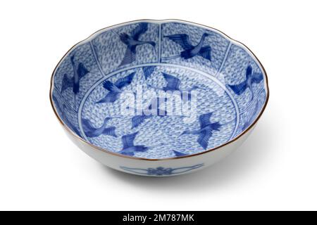 Traditional Japanese blue and white bowl decorated with cranes isolated on white background Stock Photo
