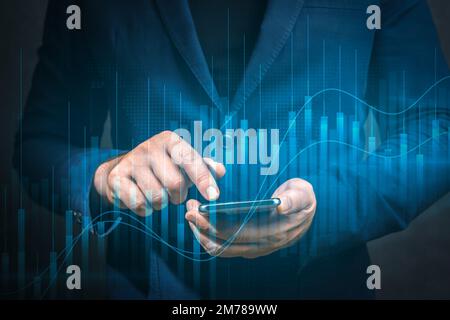 Businessman using mobile cellphone. Business global internet application technology and digital marketing. Virtual screen graph chart digital technolo Stock Photo